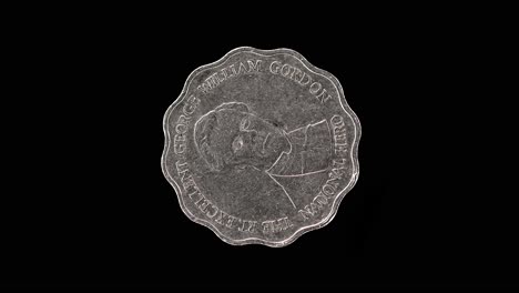 jamaica 1999 10 dollars coin reverse with george william gordon rotating on black background