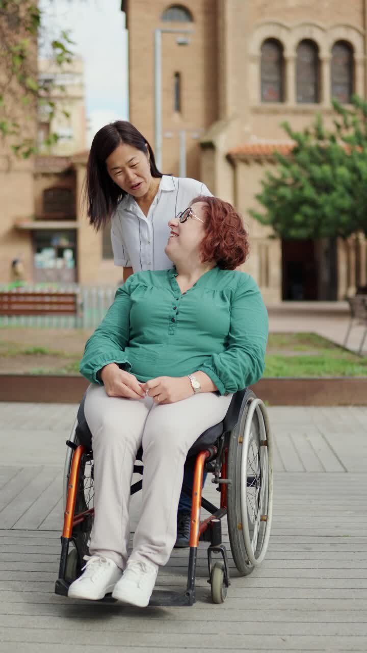 Woman in wheelchair with a friend