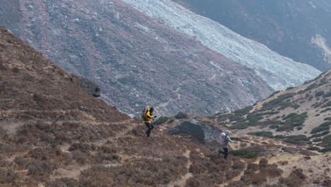 tourists enjoy downhill running at dingboche on everest base camp trek. scenic landscape, serene nature, and friendly atmosphere of nepal for travel and tourism exploration drone shot