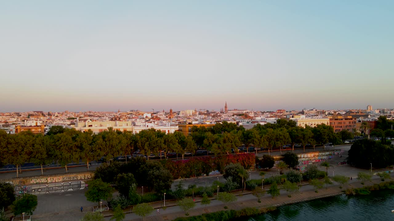 Ascending Shot from Guadalquivir River to Seville Skyline