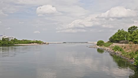 cooum river with indian coast guard regional headquarters and clouds near marina beach, triplicane, chennai, tamil nadu, india. day time, zoom out shot, 4k.