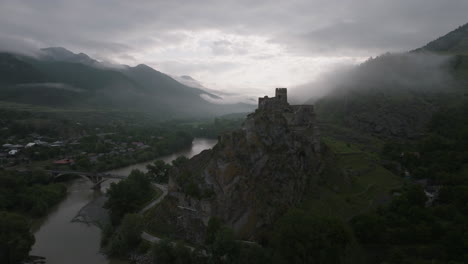 dramatic view of atskuri fortress remains against overcast sky in samtskhe-javakheti, south georgia