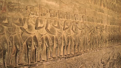 angkor wat temple corridor wall artwork in bas relief, cambodia