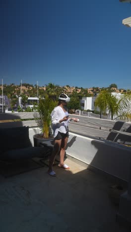 woman using vr headset on a balcony