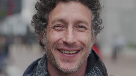 Happy-man-smiling-portrait-in-urban-city-scene