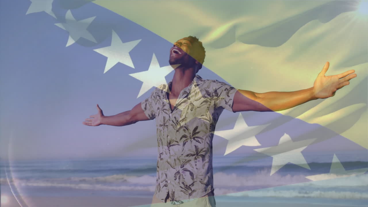 Man with arms outstretched on beach overlaid with star pattern animation