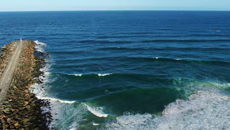 Gold-Coast-seawall,looking-out-to-sea,waves-crashing-Slow-motion-sunset