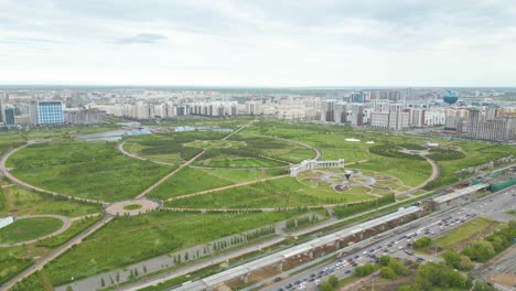 Aerial View of a Modern City with a Large Circular Park and Urban Infrastructure