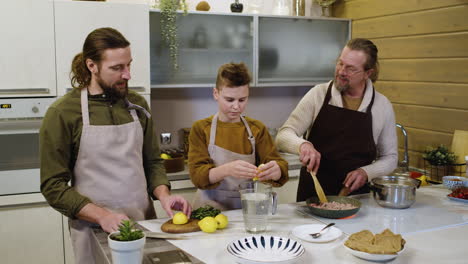 caucasian men and boy in the kitchen