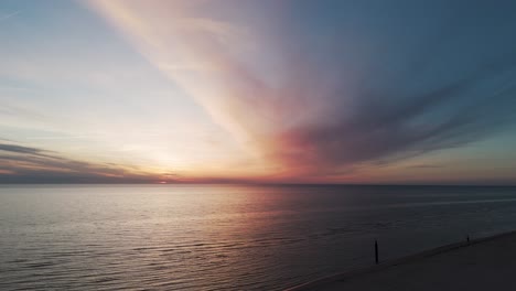 beautiful aerial establishing view of baltic sea coast on a sunny evening at bernati, latvia