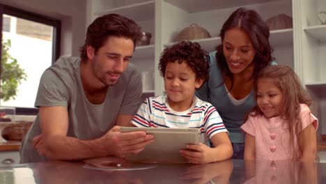 Smiling-Hispanic-family-on-a-tablet