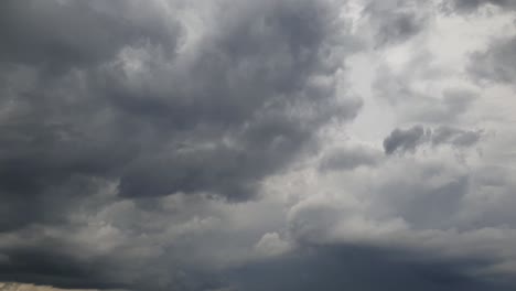 Mid-afternoon-thunderstorm-rain-clouds-forming-and-blending-across-the-african-horizon-time-lapse,-noise-free-4k-footage