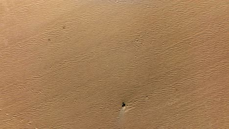 overhead view of beach sand patterns, concept of drought