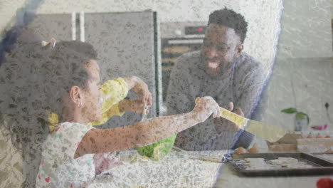 family group baking cookies in kitchen, showcasing education with animated spatula and flour icons