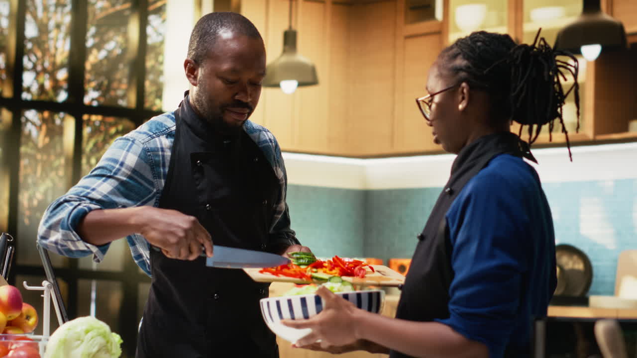 Chefs Preparing a Salad in a Kitchen