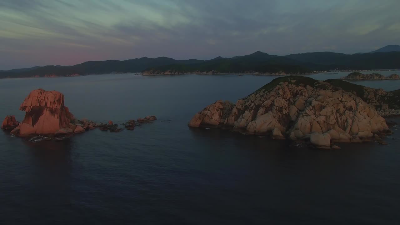View from a drone to a beautiful island in the Triozerie Bay at sunrise