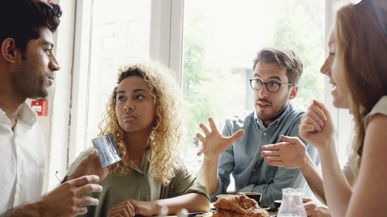 Businessman holding solar panel in green energy meeting