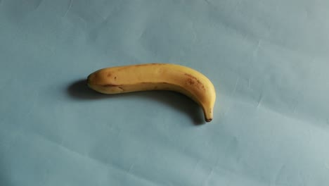 bananas rotate in a circle isolated on blue background