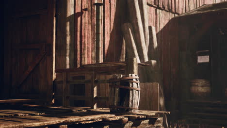 rustic wooden barn with barrel on porch