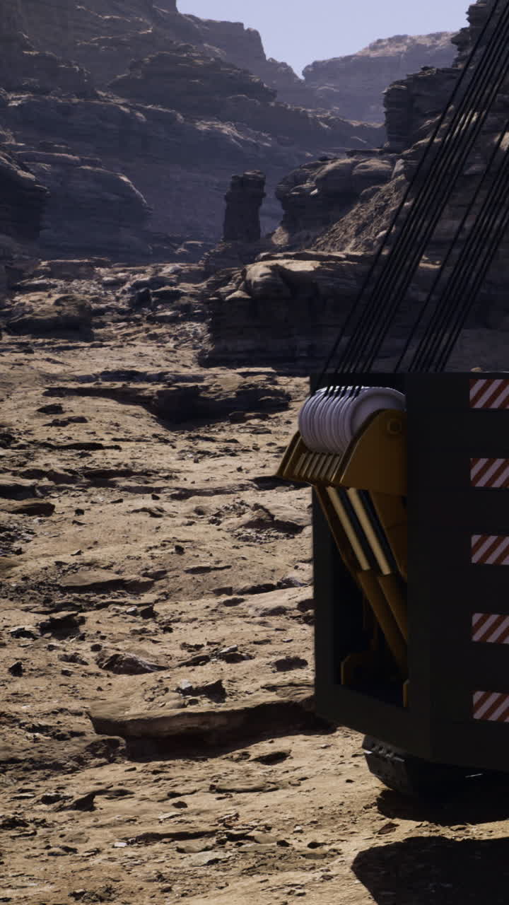 Construction vehicle works on rocky terrain in a desert area during daylight
