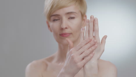 woman applying hand cream