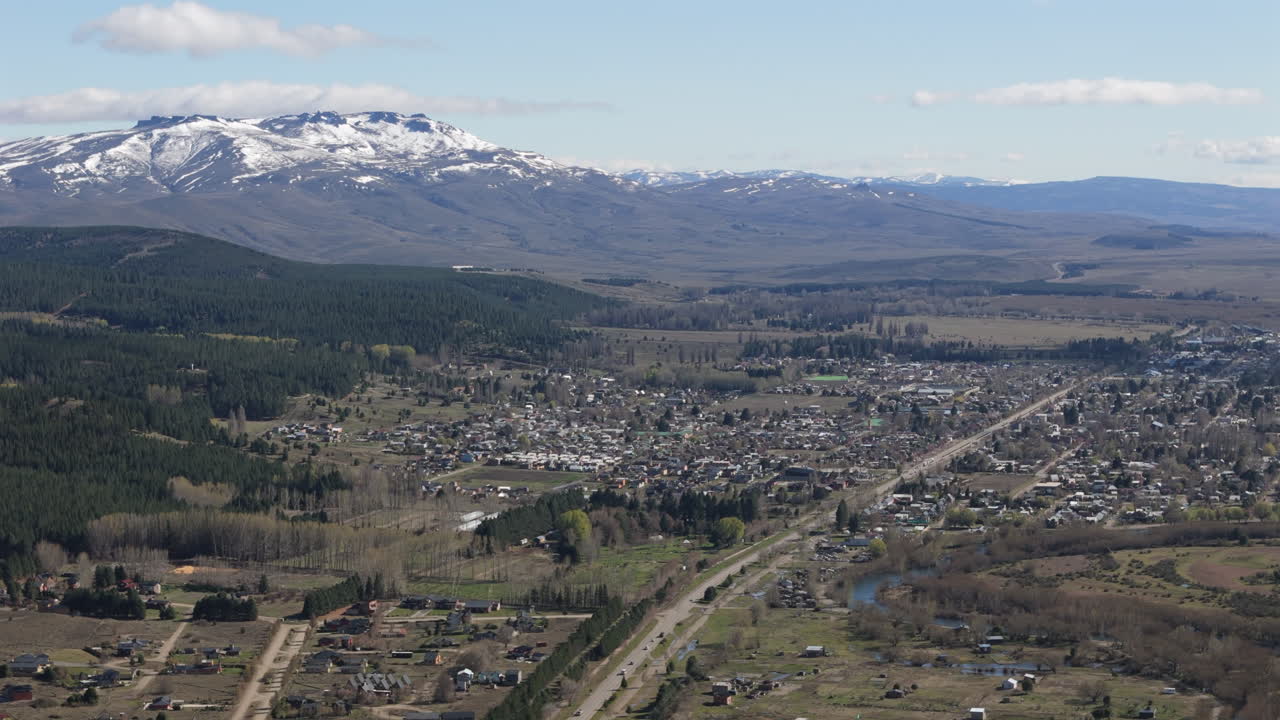 Aerial view of junin de los andes showcasing its urban layout against the backdrop Lanin volcano in the andes mountains, patagona, neuquen, argentina