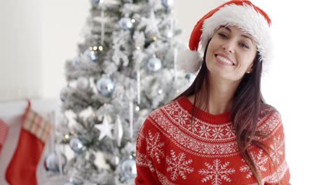 Happy-smiling-young-woman-in-a-Santa-hat