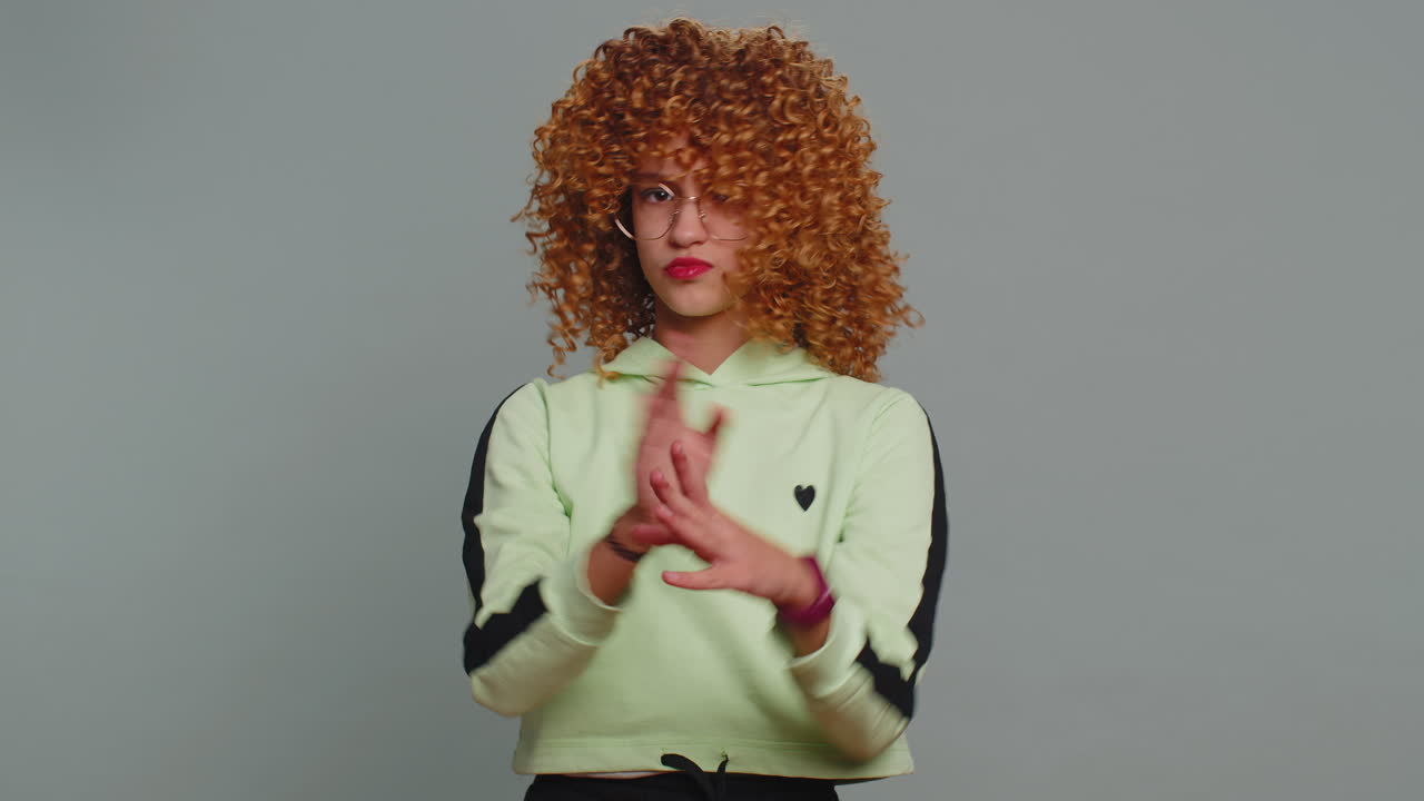 Angry girl say no hold palm folded crossed hands warning of finish stop gesture declining talk