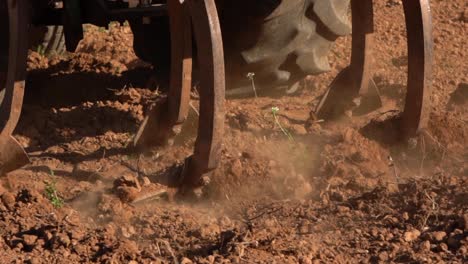 Tractor-working-the-land-with-trailer-in-slow-motion