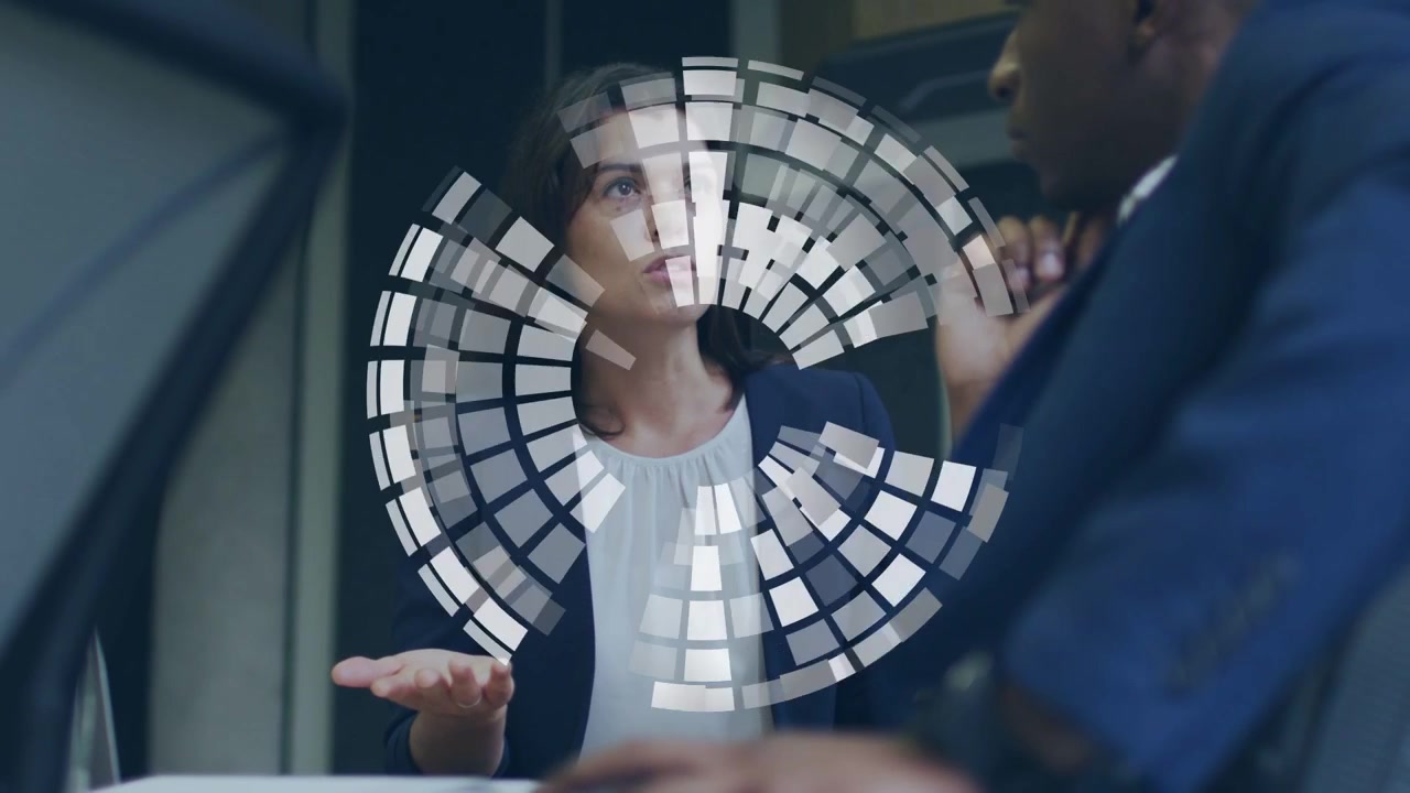 Woman speaking and pointing, mosaic sphere appearing and rotating, obscuring team, showing business