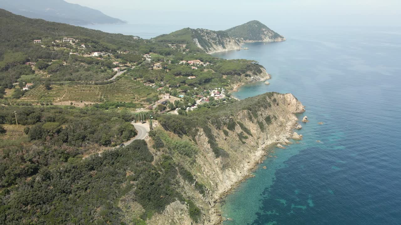 island of elba in italy mediterranean coast aerial images of the beach with turquoise blue waters, flight with drone european tourism portoferrario