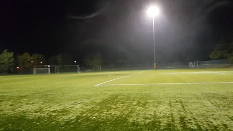 Panning-view-of-empty-soccer-field-during-the-night-in-Germany