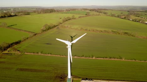 Wind-turbines-and-agricultural-fields-on-a-summer-day---Energy-Production-with-clean-and-Renewable-Energy---aerial-shot,-Staffordshire