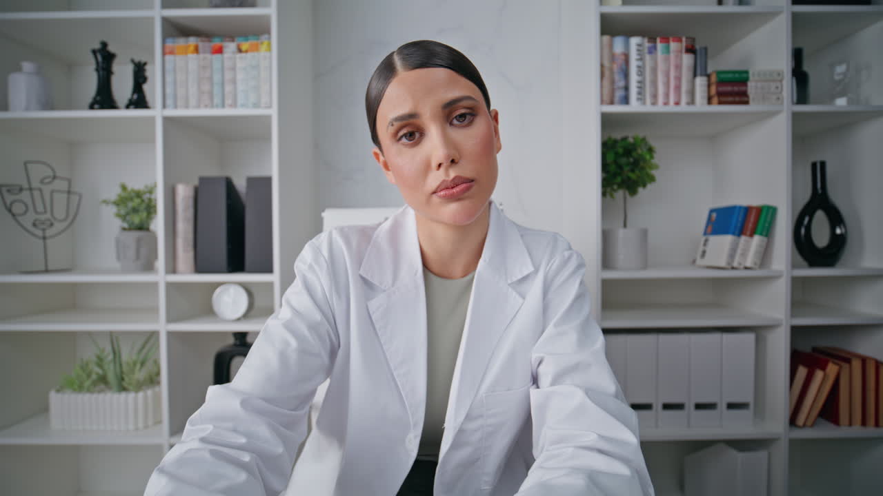 Therapist providing online conference at clinic office closeup. Portrait doctor