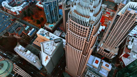 approaching bank of america corporate center the highest building in charlotte, nc. top view on downtown at daytime