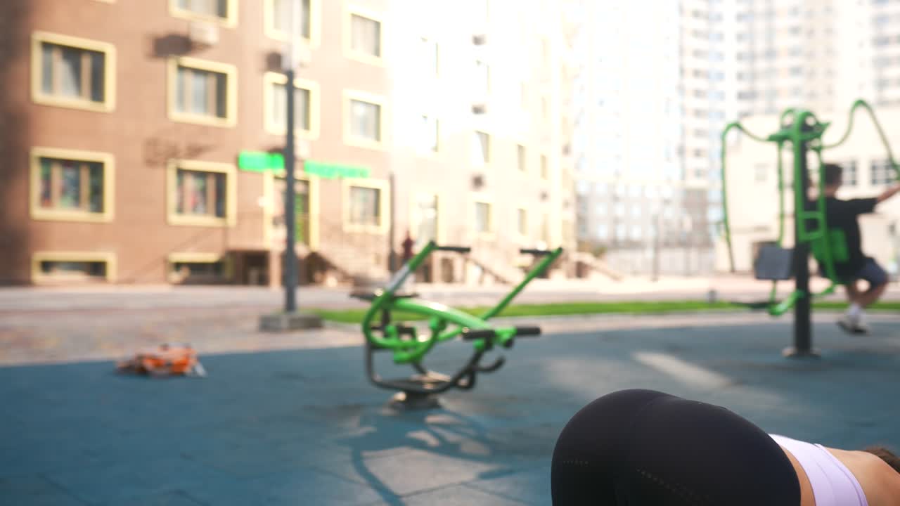 Woman exercising outdoors in a fitness park