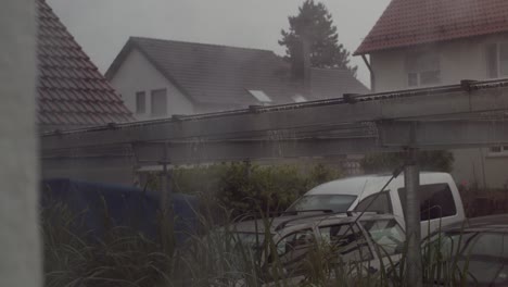 heavy rain and thunderstorm in an german neighborhood