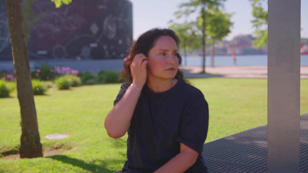 Woman sitting in a park on a sunny day