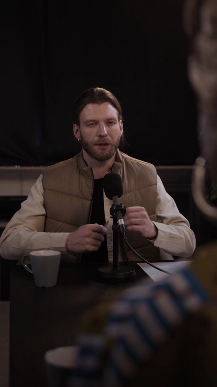 Man Speaking Into Microphone During Podcast Recording