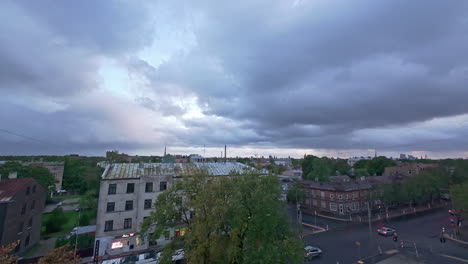 clouds over a town on an overcast day - time lapse from above a village street