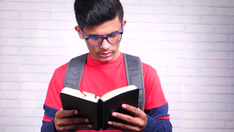 young man reading a book