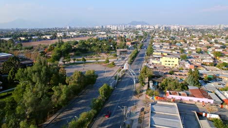 Daylight-Cityscape,-Lo-Prado-Neighborhood-of-Santiago-de-Chile-drone-Fly-streets-of-South-American-Capital,-traffic-and-Andean-Cordillera-background