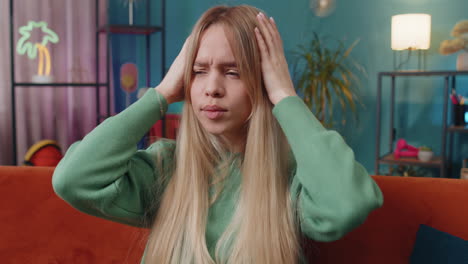 displeased caucasian woman rubbing temples to cure headache problem, suffering from migraine, stress