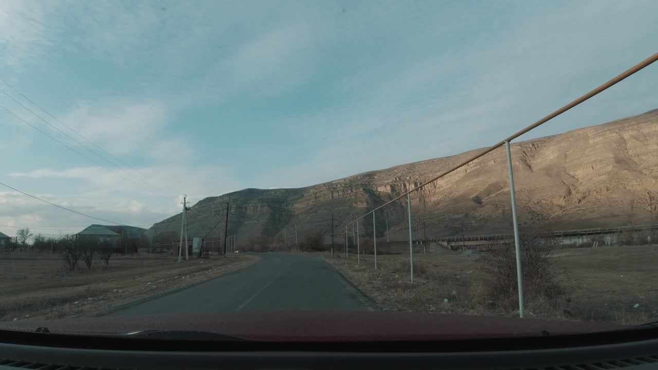 Passing by an old train track in the middle of a remote village.