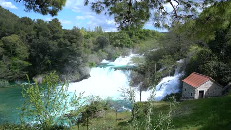 Beautiful-waterfalls-in-the-famous-Croatian-Krka-National-Park-with-flowing-and-rushing-water-in-early-summer