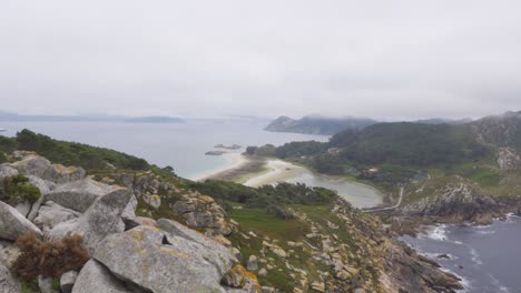 A-Panning-Shot-from-Up-High-of-Moody-and-Overcast-Cies-Islands,-Spain-in-the-Atlantic-Ocean