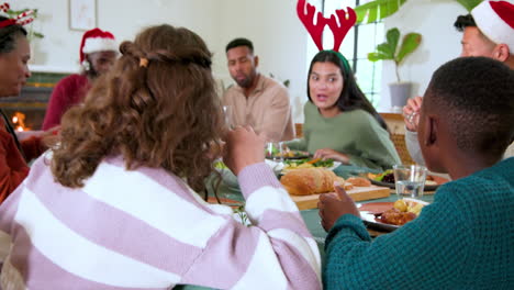 At Christmas, Diverse family enjoying festive holiday meal together, sharing laughter and delicious