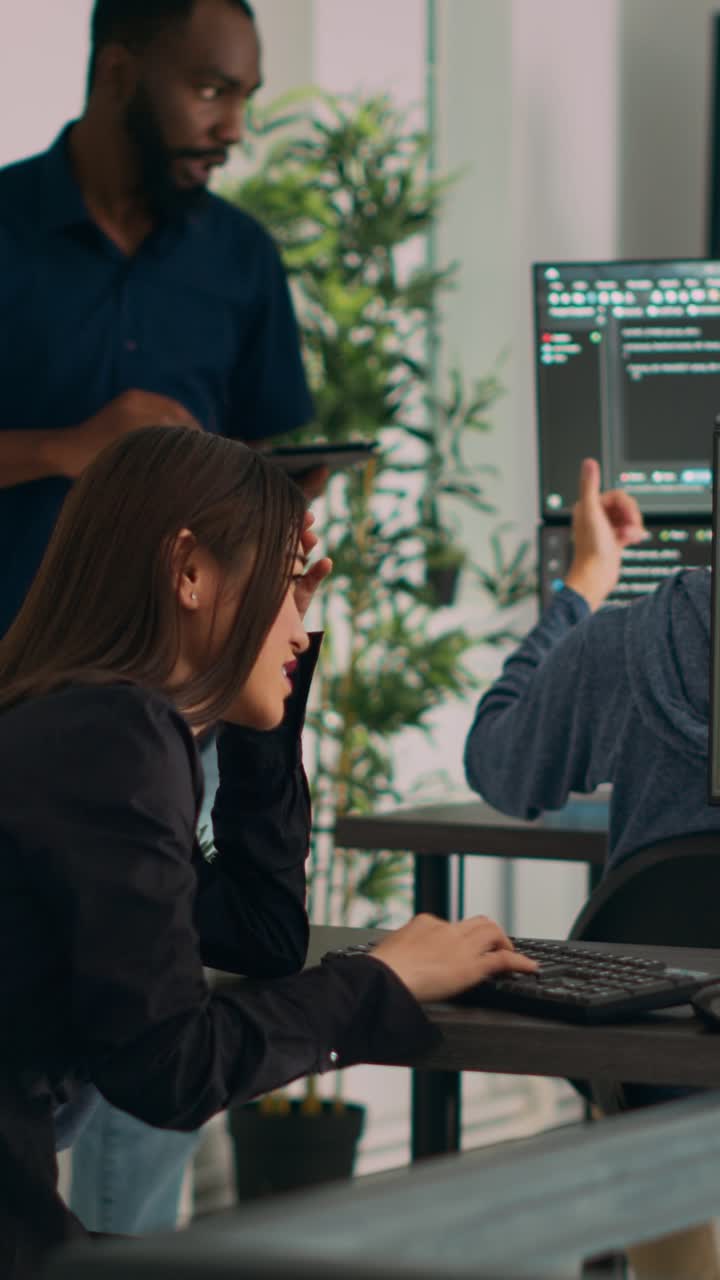 Vertical video: Asian system engineer trying to find html script and code to program cloud computing