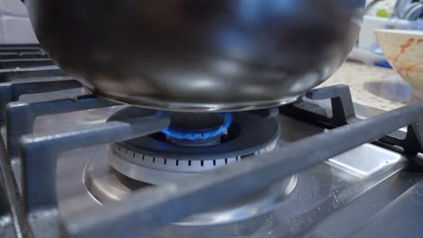 gas stove range in kitchen burning minimum fire