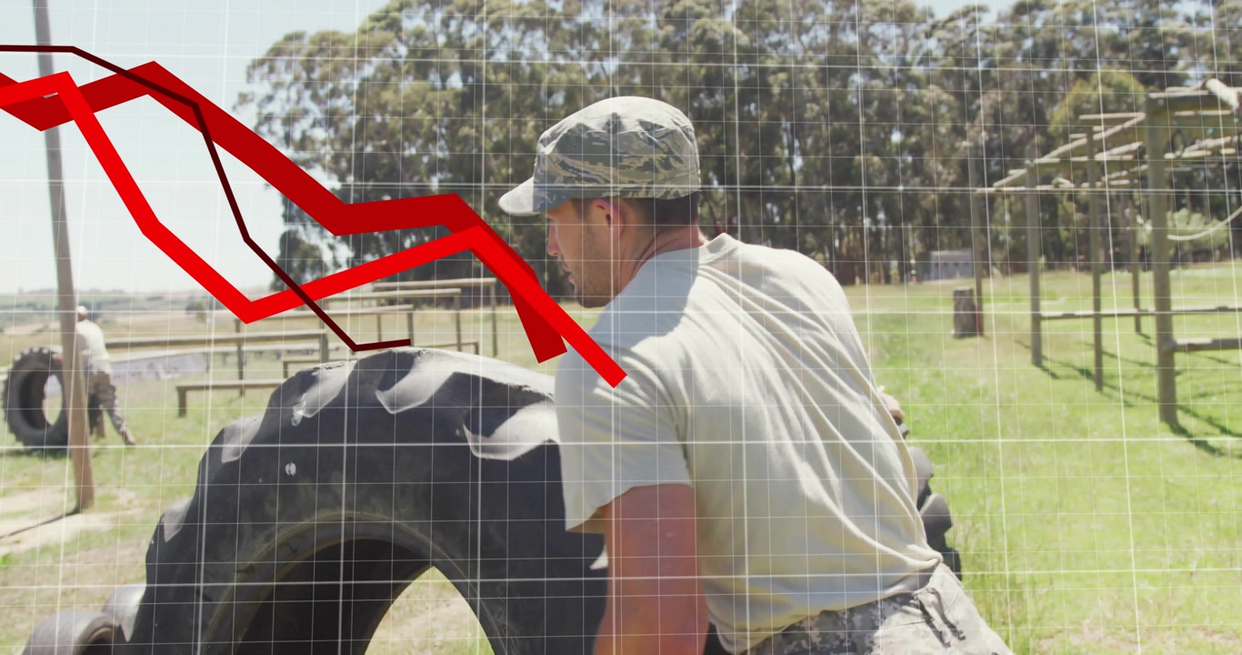 Mid adult man on start pushing tire across military field for training with animated distance